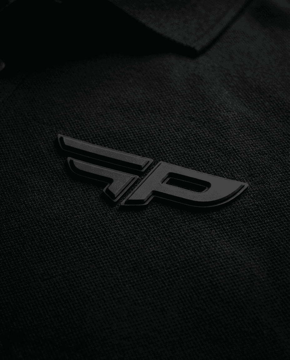 Close-up of the rubberized FP logo on the FLAP Signature polo